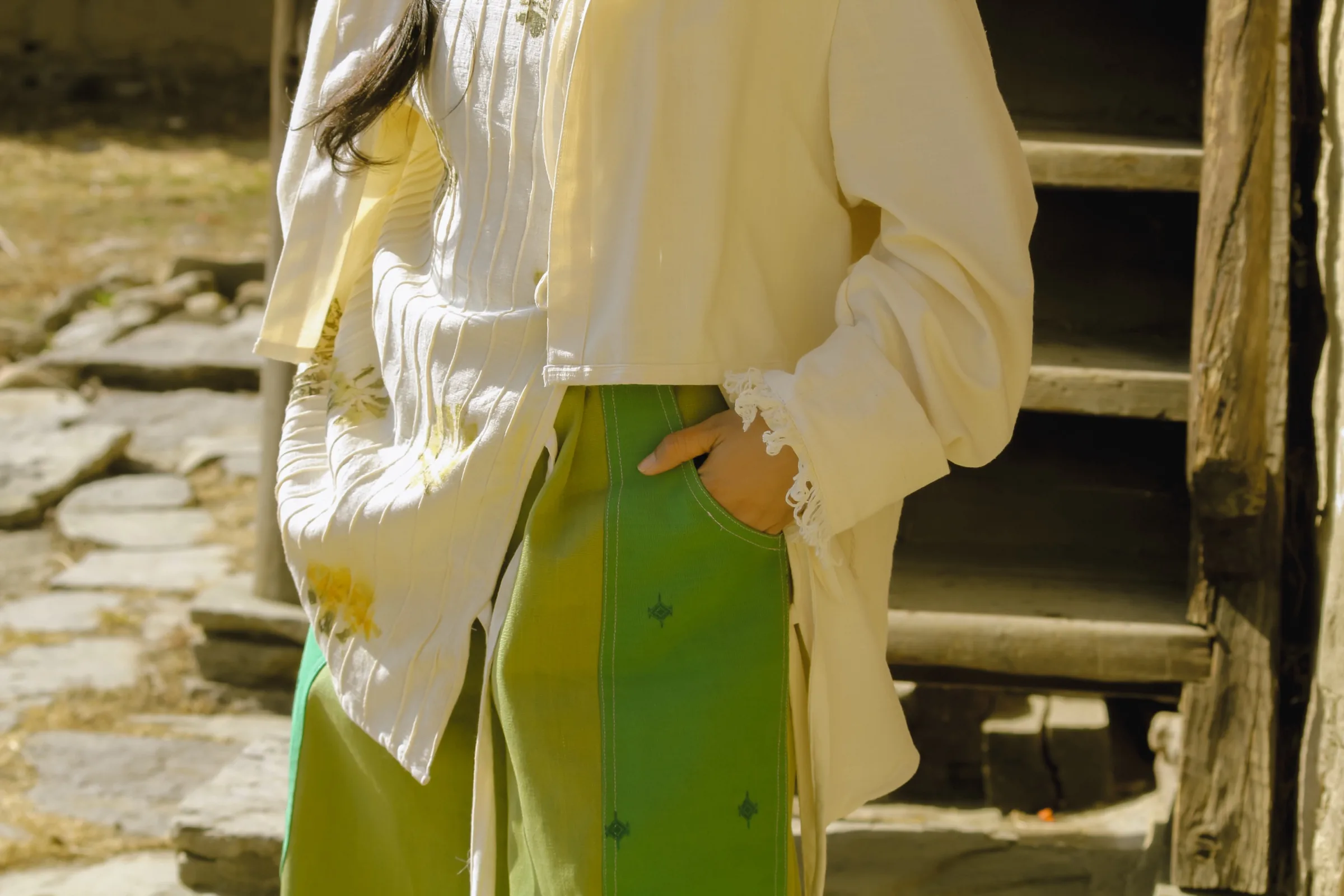 Close detail of the eco-printed jacket and patterned skirt