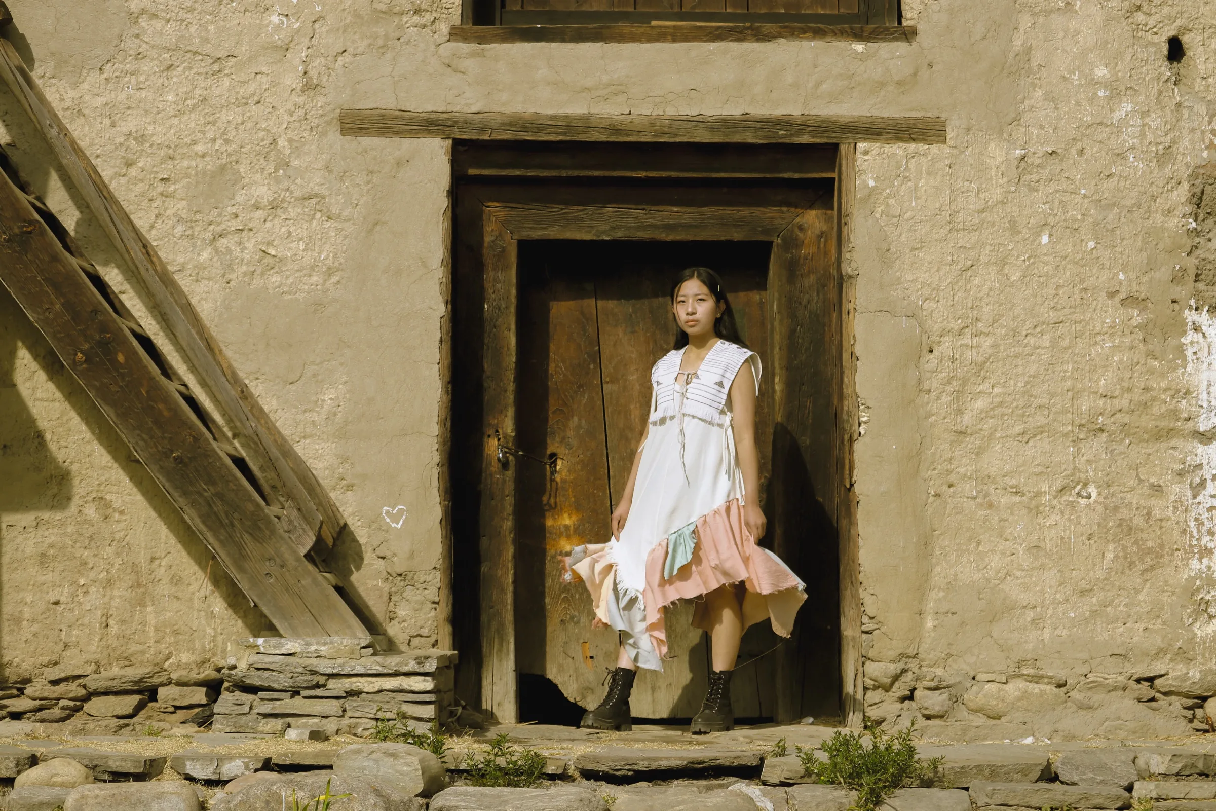 The dress in a village doorway