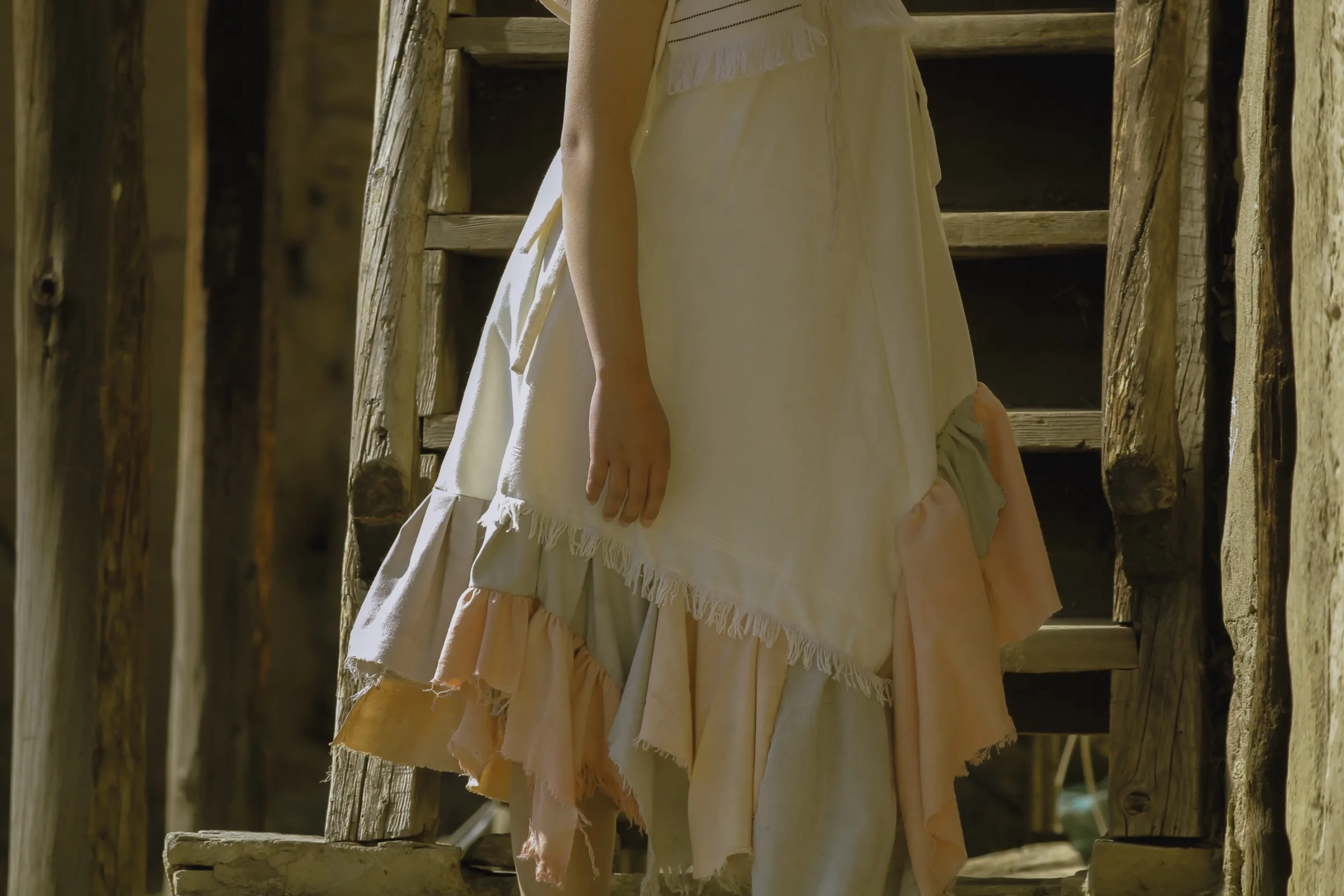 Hem detail, layered peach and sage naturally-dyed ruffles