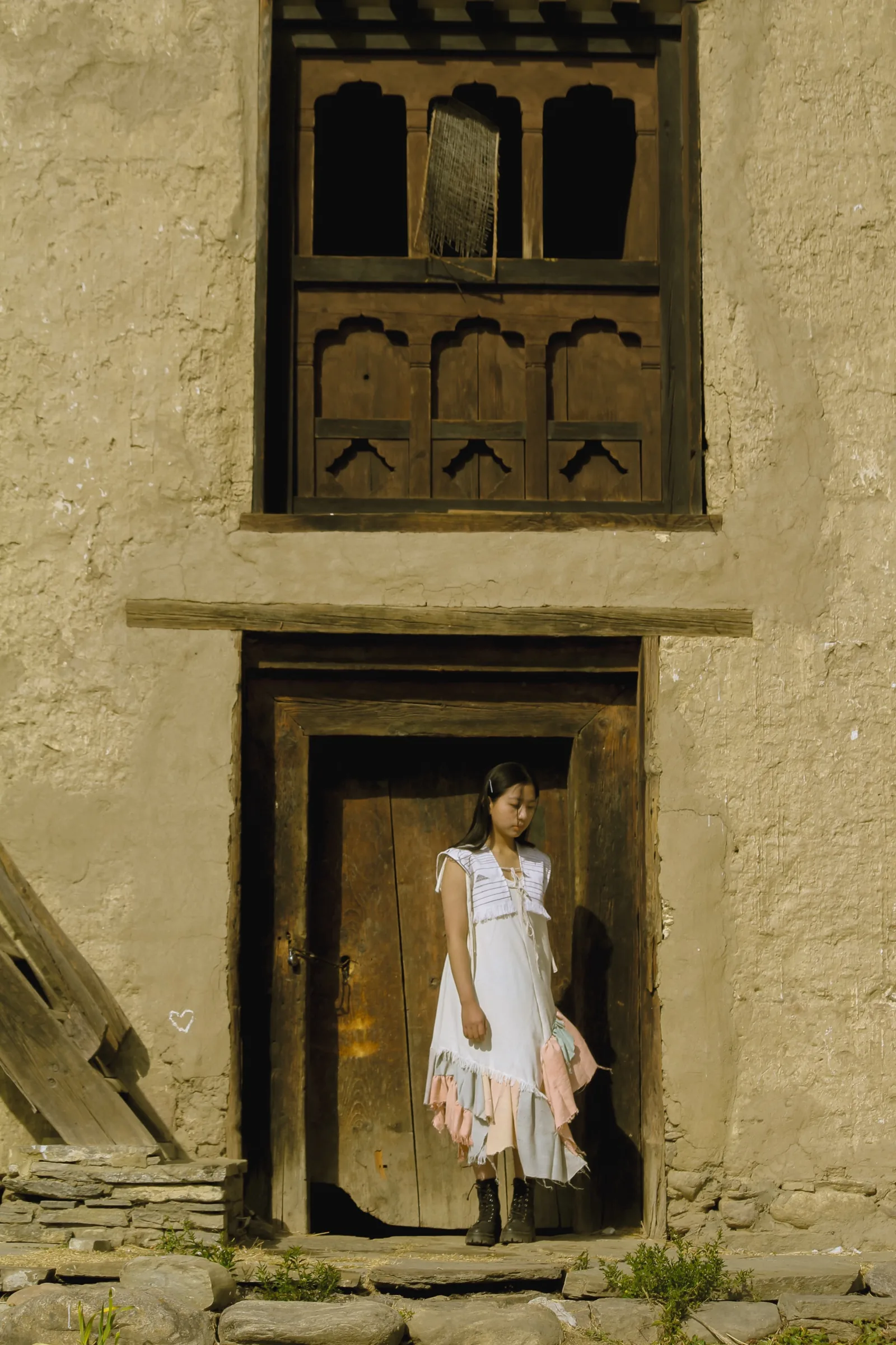 Standing portrait in the naturally-dyed dress