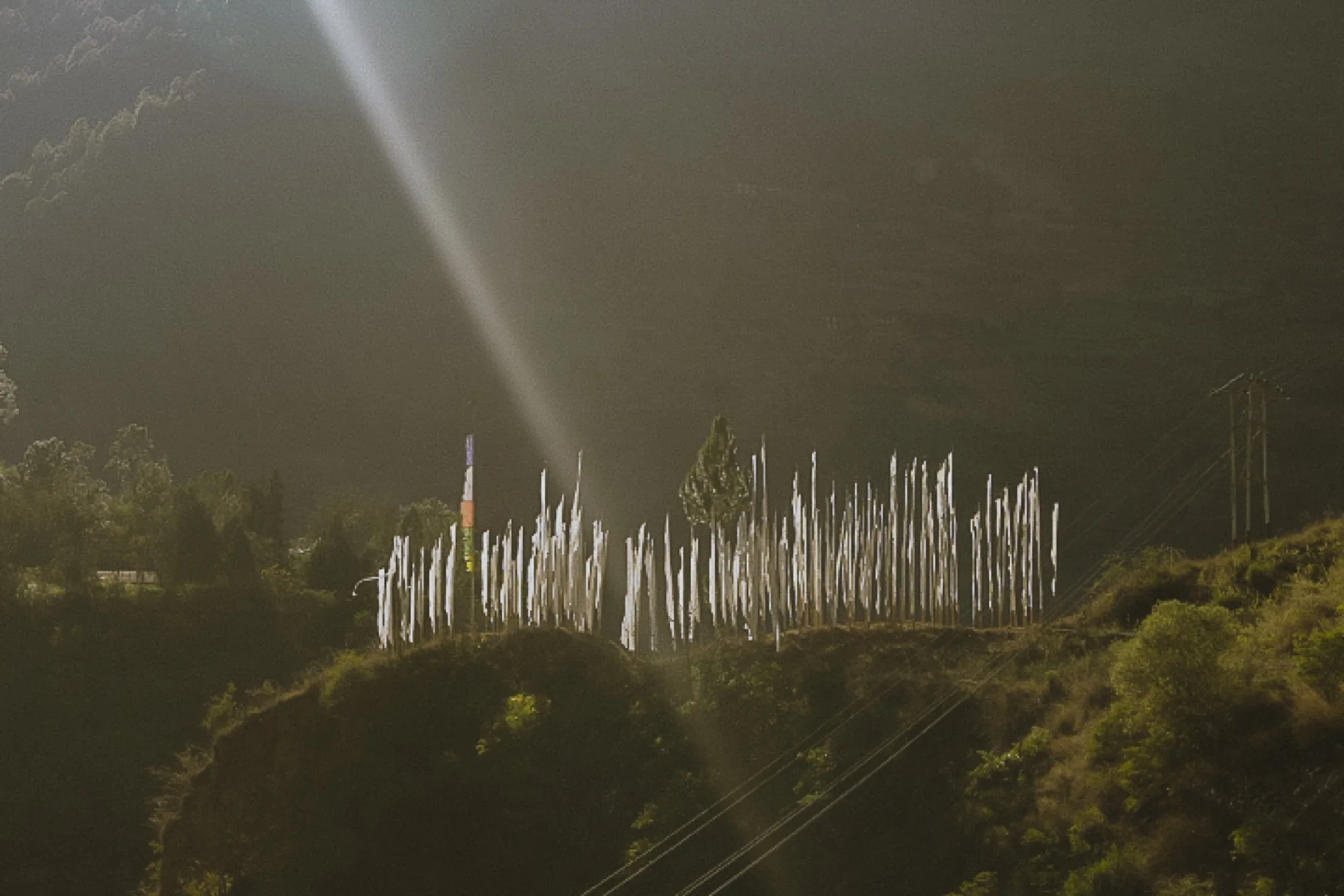 Prayer flags catch the first sun above Khoma