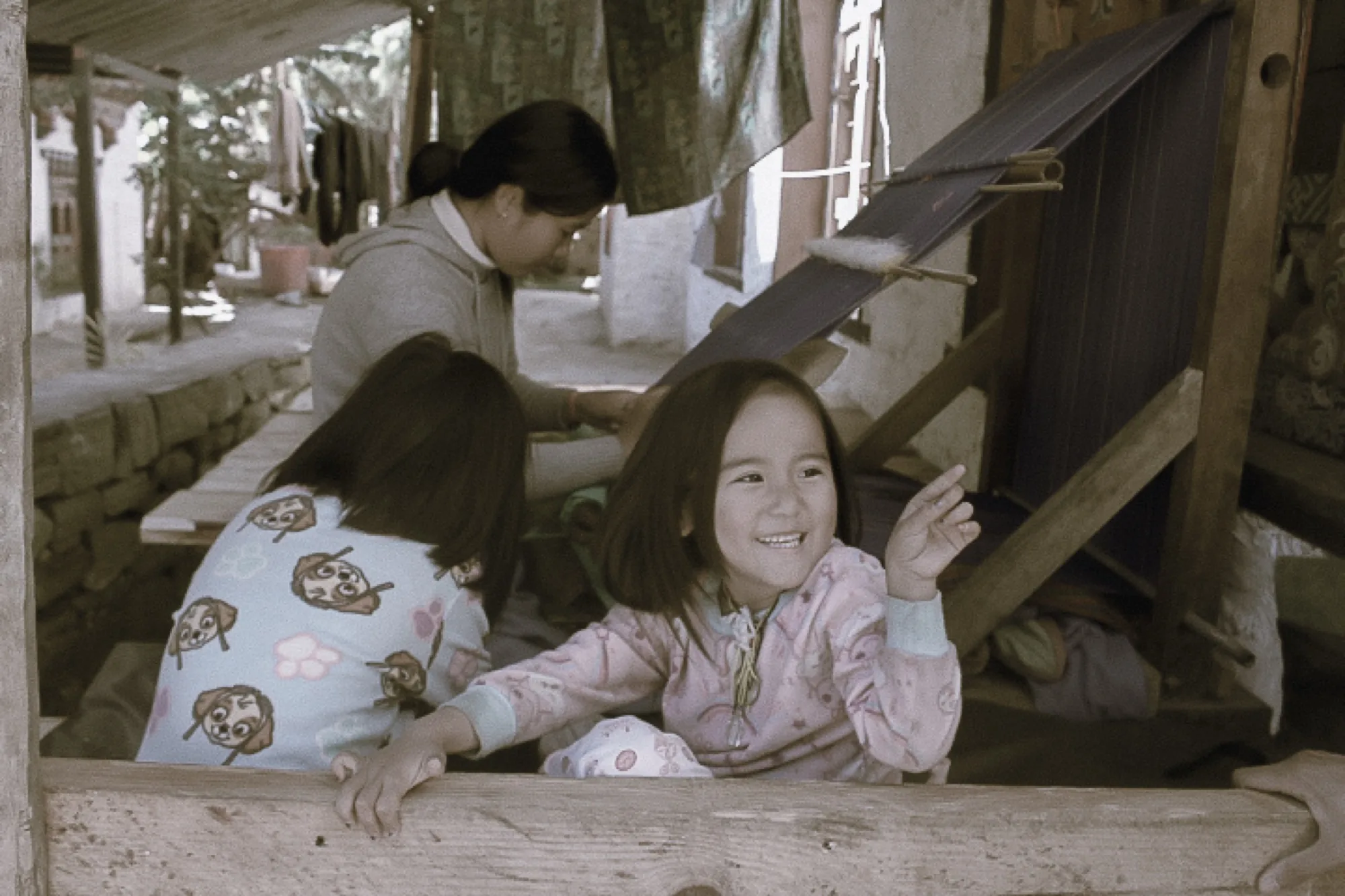 Silk threads tensioned across the loom