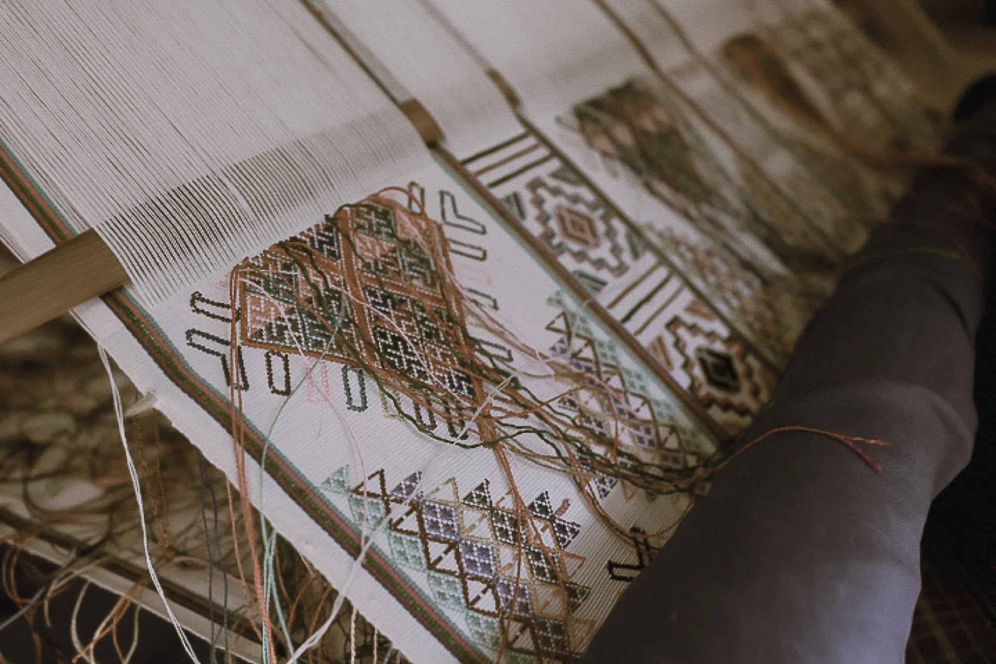 Supplementary weft patterns floated over the silk base